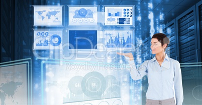 Businesswoman touching and interacting with technology interface panels