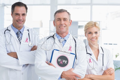 Doctors with breast cancer awareness ribbon