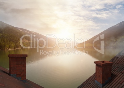 Roofs with chimney and lake mountain landscape