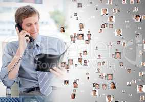 Man holding phone and contact book with Profile portraits of people