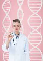 Doctor woman standing against pink background with DNA strands