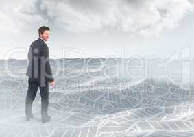 Businessman in sea of documents under sky clouds