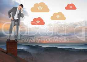 Upload cloud icons and Businessman standing on Roof with chimney and misty colorful sky landscape