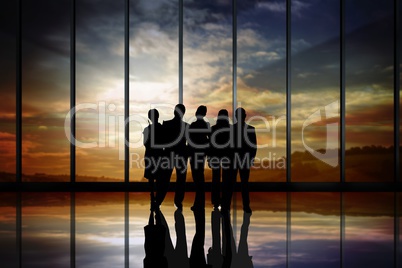 Business people silhouettes against building