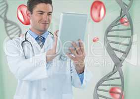 Doctor man using a tablet with 3D DNA strand and cells