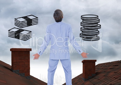 Money icons and Businessman standing on Roofs with chimney and cloudy sky