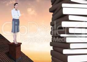Woman on roof looking at 3D books