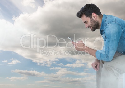 man on phone under sky clouds