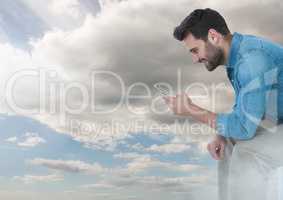 man on phone under sky clouds