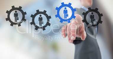 Businessman interacting and choosing a person from group of people icons with settings gear cogs