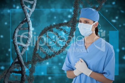 Doctor woman standing with 3D DNA strands against blue background