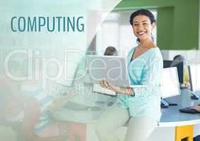 Computing text and Teacher with class in computer room