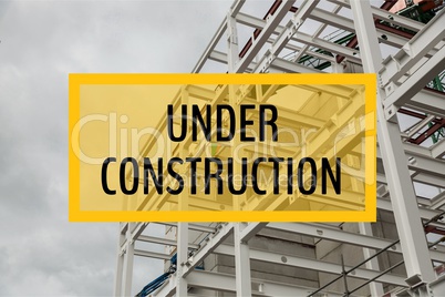 Under construction text against construction photo