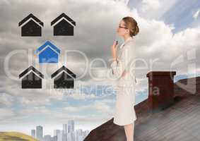 Home icons and Businesswoman standing on Roof with chimney and city in distance