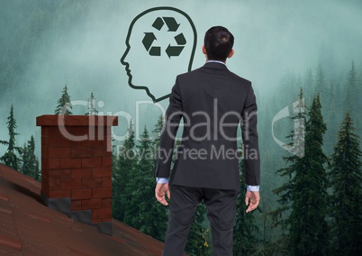 Head with recyclable sustainable icon and Businessman standing on Roof with chimney and misty forest