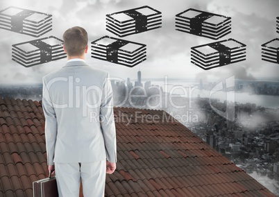 Money icons and Businessman standing on Roof with chimney and misty city