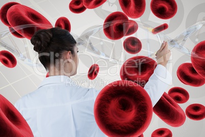 Doctor woman interacting with 3D DNA strand and cells