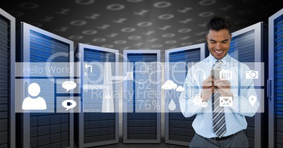 Happy business man holding a phone and graphics in server room