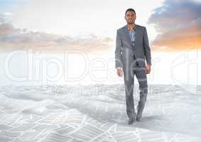 Businessman walking in sea of documents under sky clouds