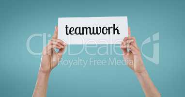 Business woman holding a card with teamwork text