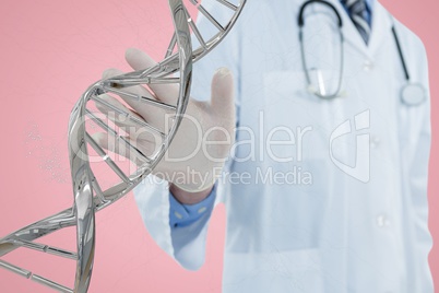 Doctor interacting with 3D DNA strand against pink background