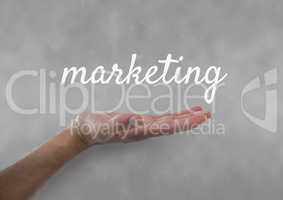 Hand interacting with marketing business text against grey background