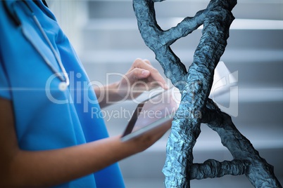 Doctor woman using a tablet with 3D DNA strands