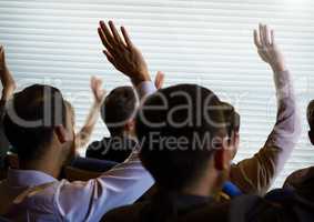 Business people with raised hands up