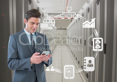 Business man holding a phone and graphics in server room