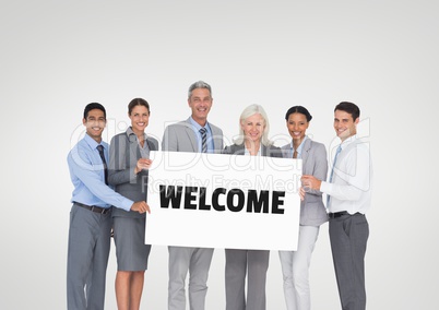 Business people holding a card with welcome text