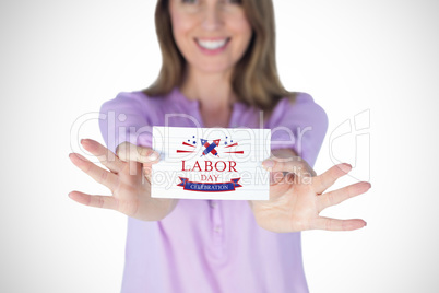 Composite image of smiling businesswoman showing blank sign