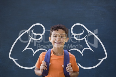 Happy student boy with fists graphic standing against blue blackboard