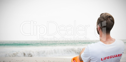 Composite image of rear view of male lifeguard sitting on chair