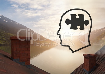 Head with puzzle piece icons over roofs by mountain lake