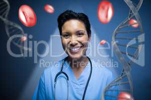 Happy doctor woman standing with DNA strands and cells