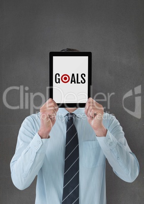 Business man holding a tablet with goals text