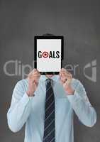 Business man holding a tablet with goals text