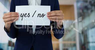Business woman holding a card with yes/no text