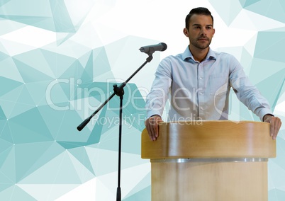 Businessman on podium speaking at conference with abstract polygon background