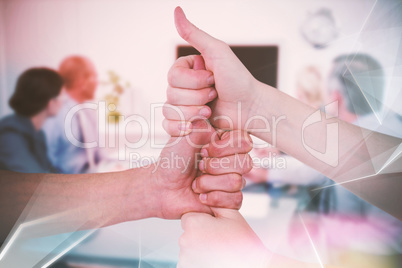 Composite image of cropped image of friends stacking fists