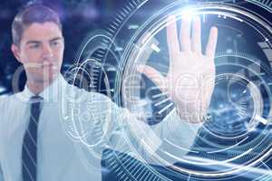 Composite image of businessman using futuristic digital screen