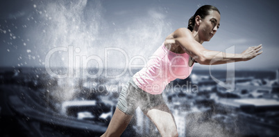 Composite image of an athletic woman starting to run