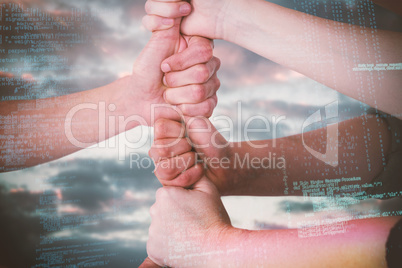 Composite image of cropped image of people stacking fists