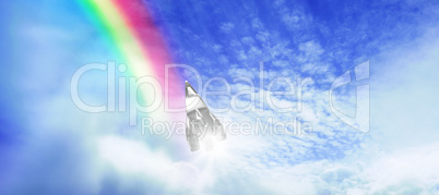 Composite image of silver colored rocket toy against white screen
