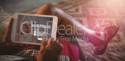 Composite image of graphic image of mortgage login page and couple holding model house