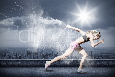 Composite image of sporty woman running on a white background