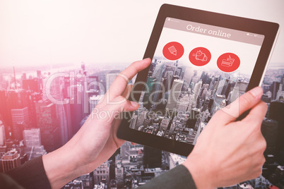 Composite image of cropped image of businesswoman holding digital tablet