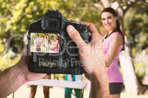 Composite image of cropped image of hands holding camera