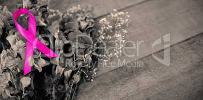 High angle view of pink Breast Cancer Awareness ribbon on flowers