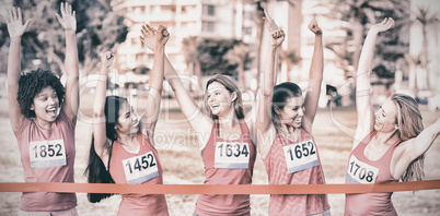 Cheering women supporting breast cancer marathon